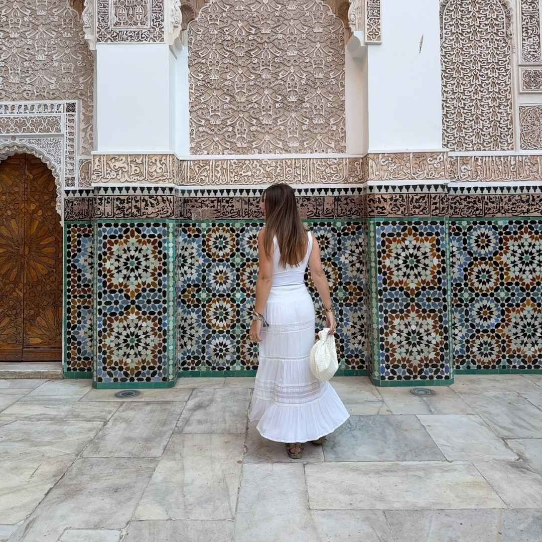 Woman exploring traditional Moroccan architecture in the best area to stay in Marrakech